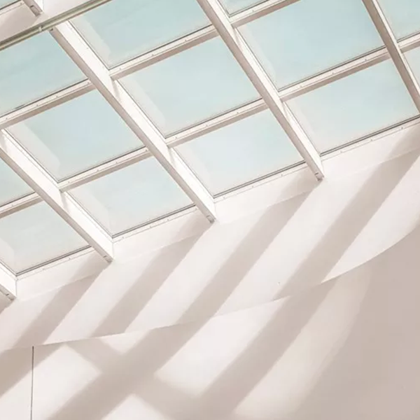 White room with a multi-paneled skylight above