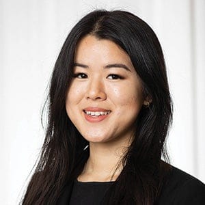Jalee Chen in a charcoal jacket against a white background