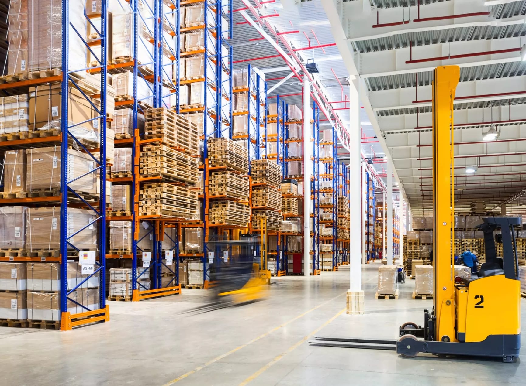 Fork lift in a full warehouse 