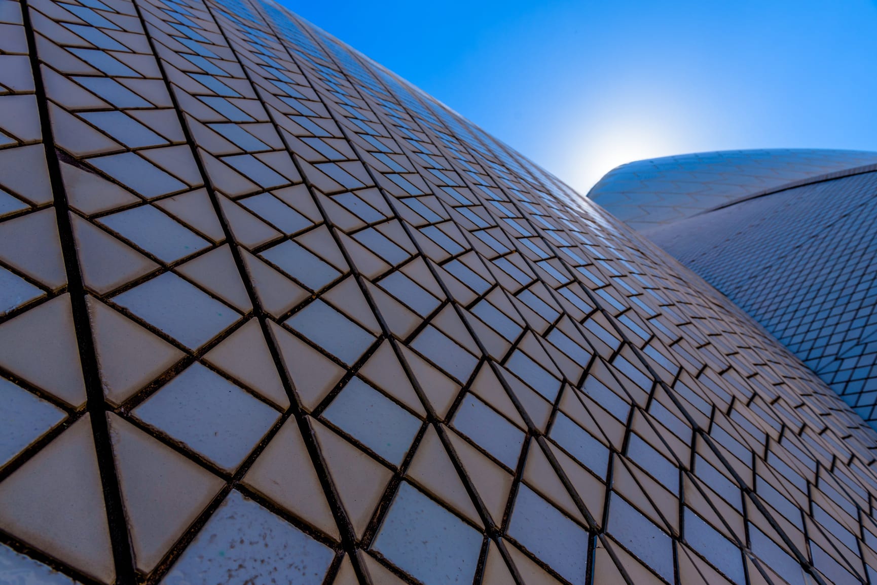 Extreme close up of Sydney Opera House's white and cream roof tiles