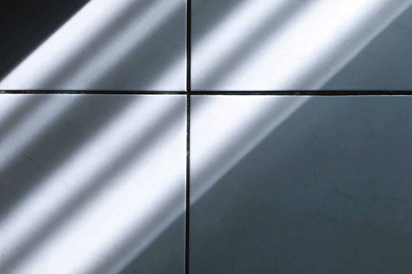 Shadows and light casting on a paneled wall