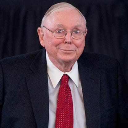 Photo of Charlie Munger against a black backdrop